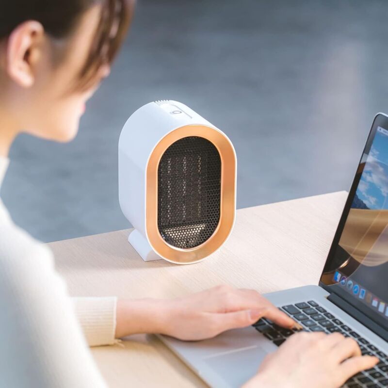 1200W ceramic PTC electric fan heater, two temperature settings, overheat protection, rapid heating, quiet operation, energy saving.