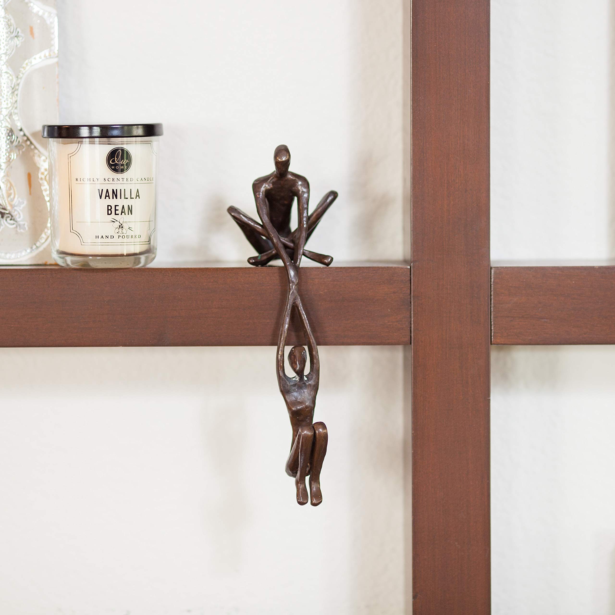 Contemporary Metal Shelf Décor - Bronze Sculpture - Man Lifting Woman from Ledge Handcrafted using the sand casting method